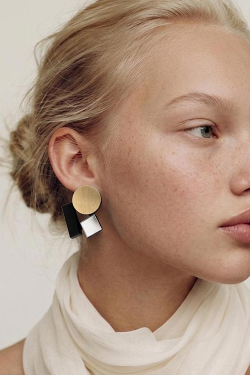 Small geometric clip-on earrings inspired by the Bauhaus school, handmade in Buenos Aires