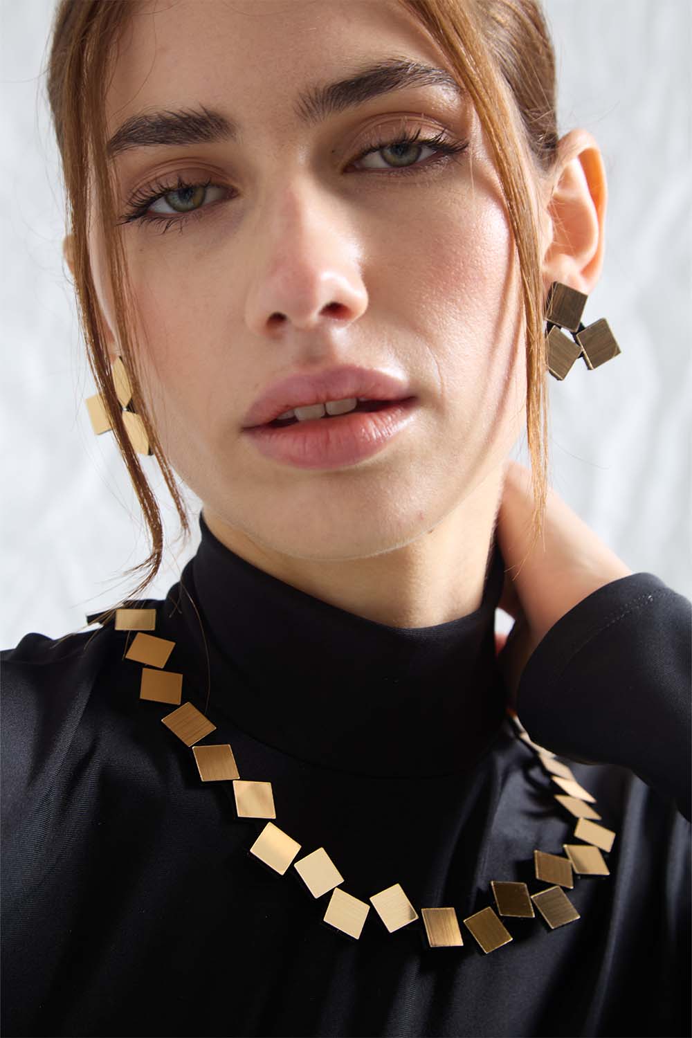 Contemporary round necklace in gold metallic acrylic and suede, handmade by Iskin Sisters, Argentina