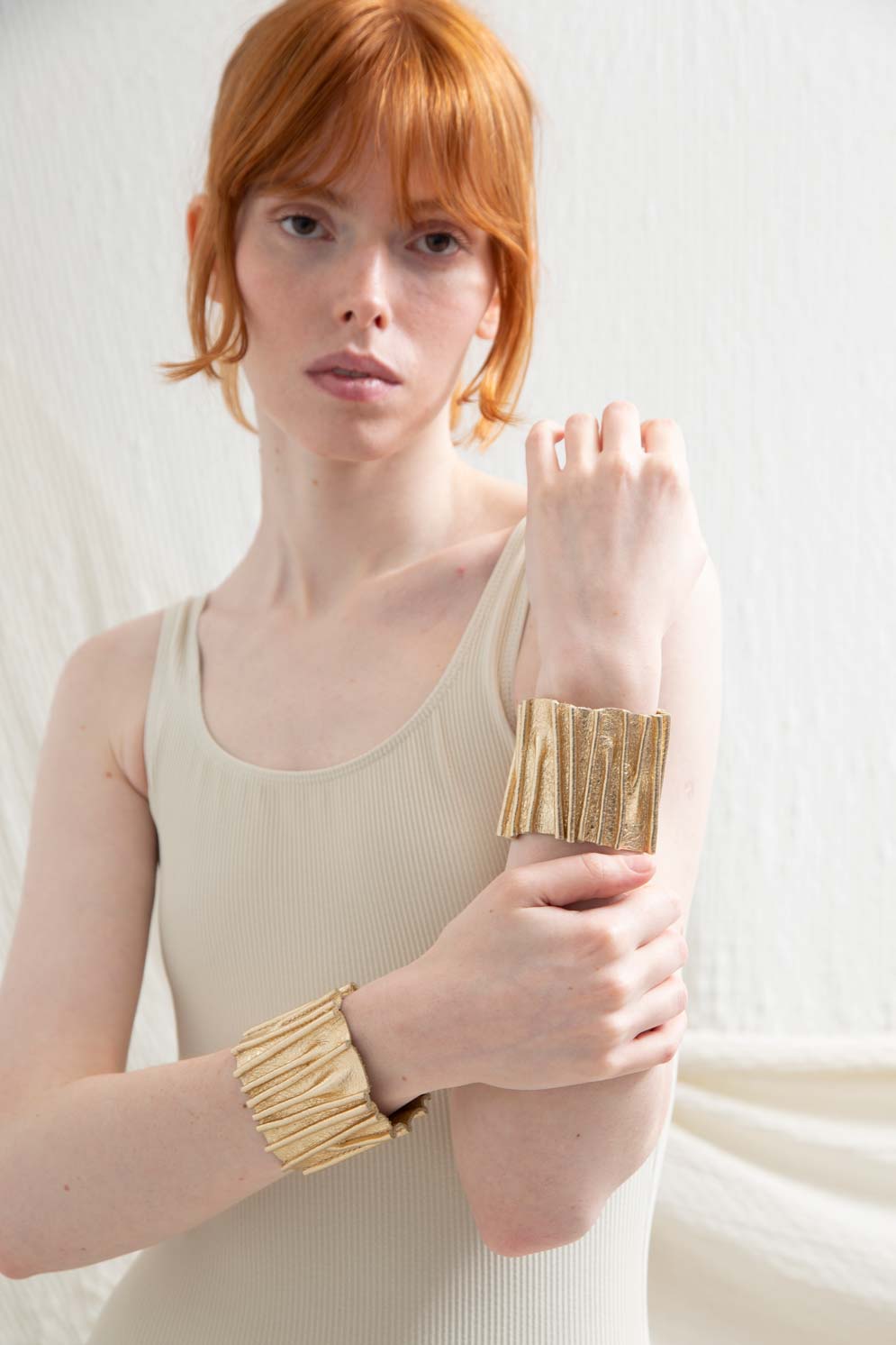Iskin Sisters Bauhaus collection stitch cuff bracelet in gold acrylic, handmade contemporary jewelry