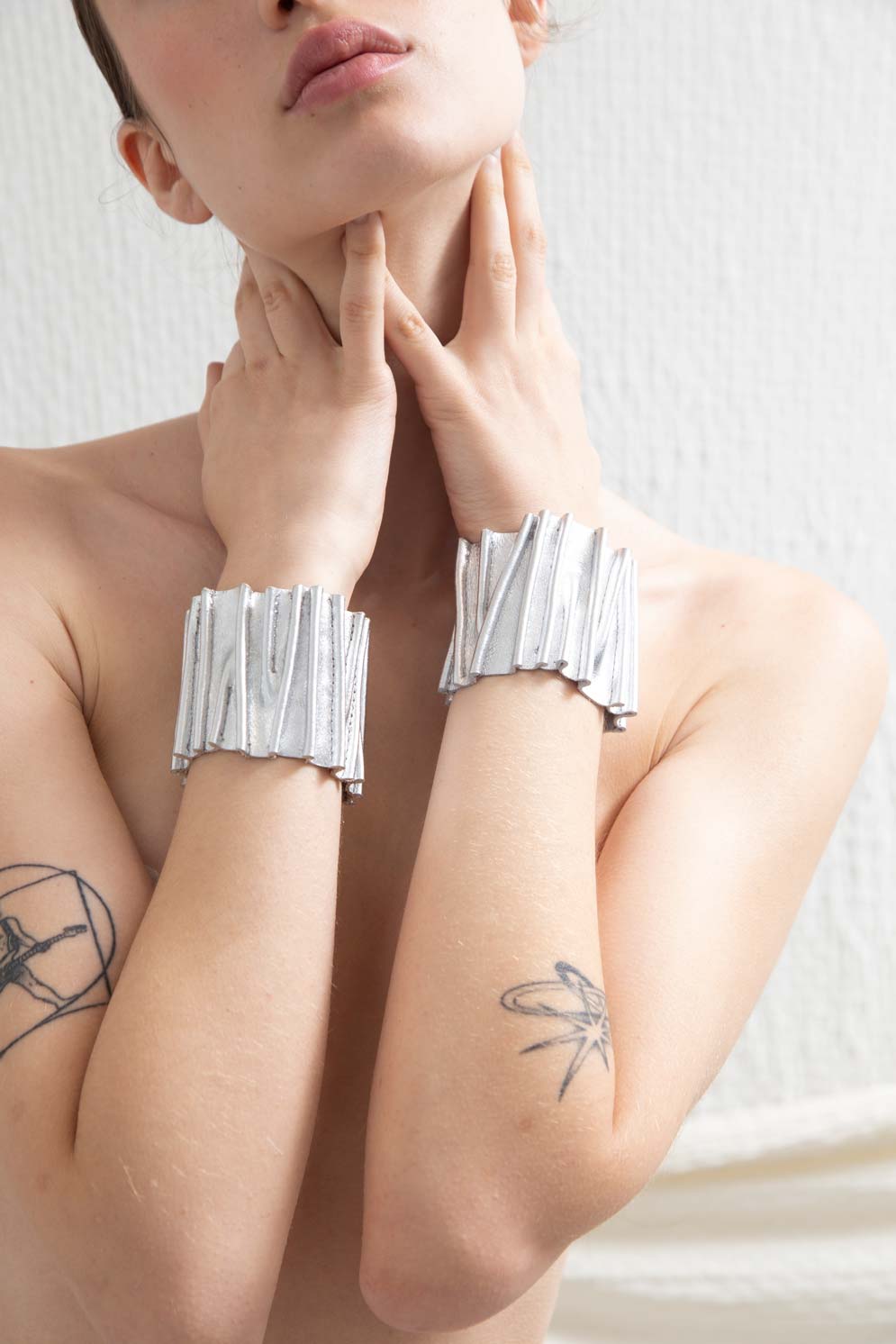 Silver acrylic stitched cuff bracelet with snap closure from the Bauhaus collection by Iskin Sisters