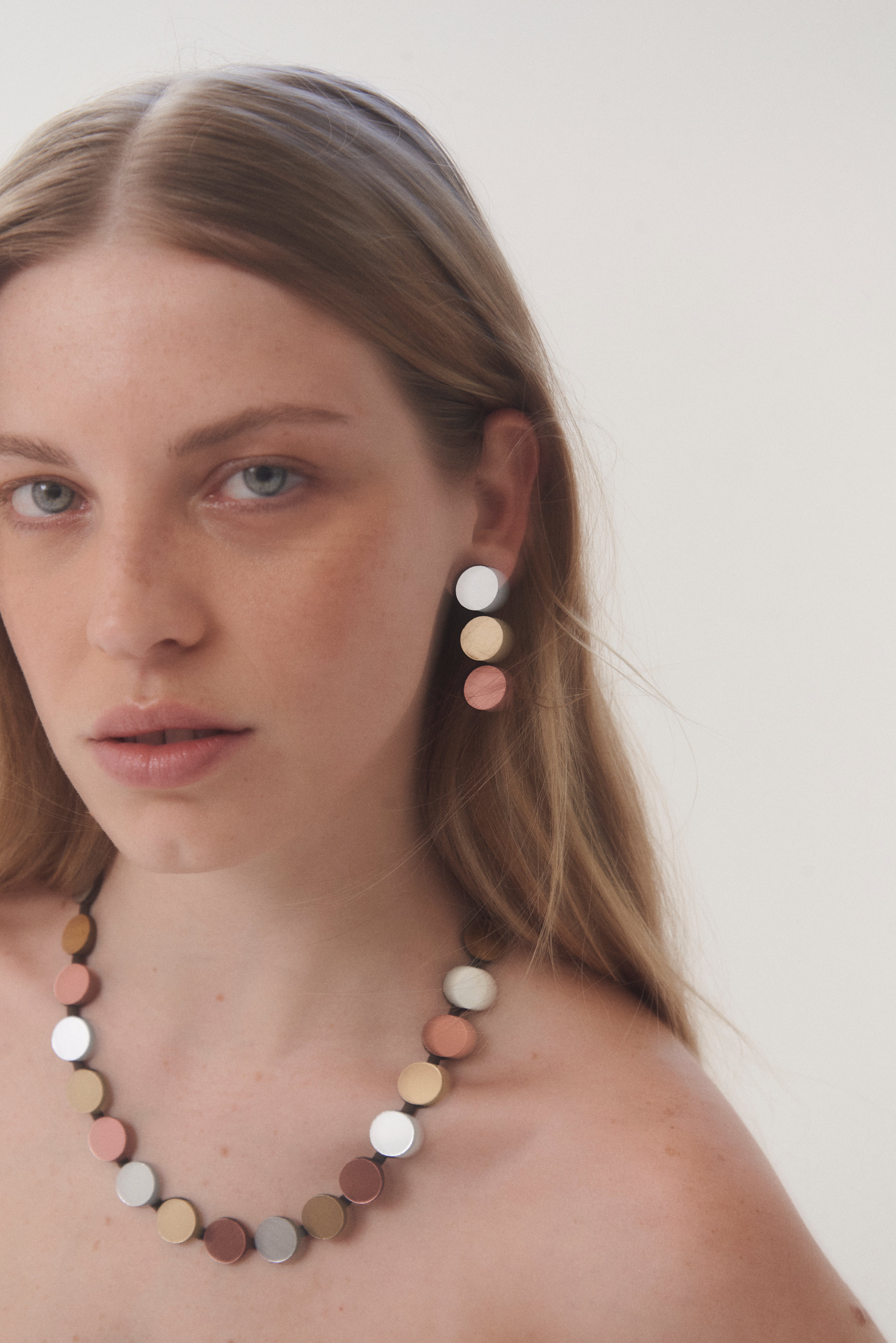 Contemporary single-strand bib necklace in acrylic and soft suede by Iskin Sisters, Argentina