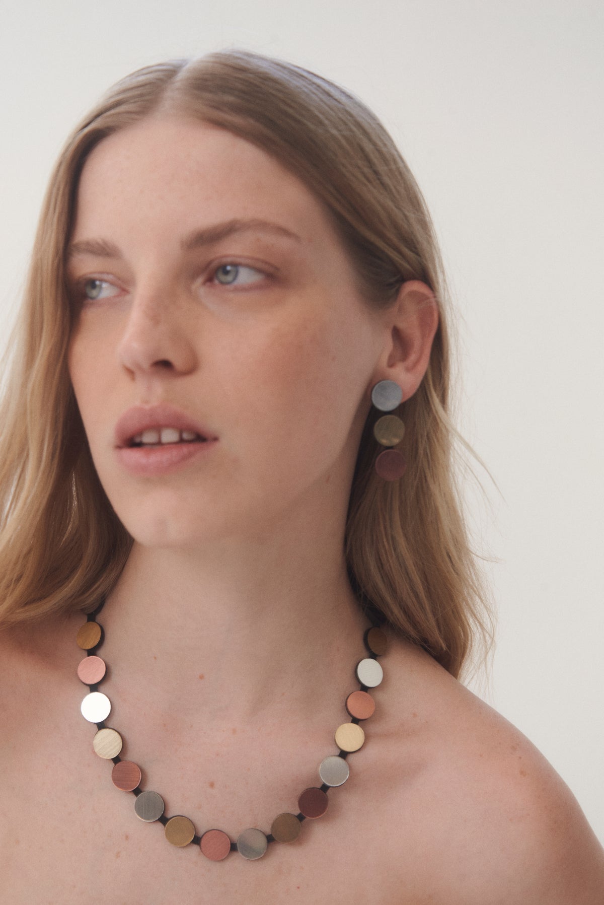 Statement strand necklace in metallic acrylic and suede by Iskin Sisters, made in Buenos Aires