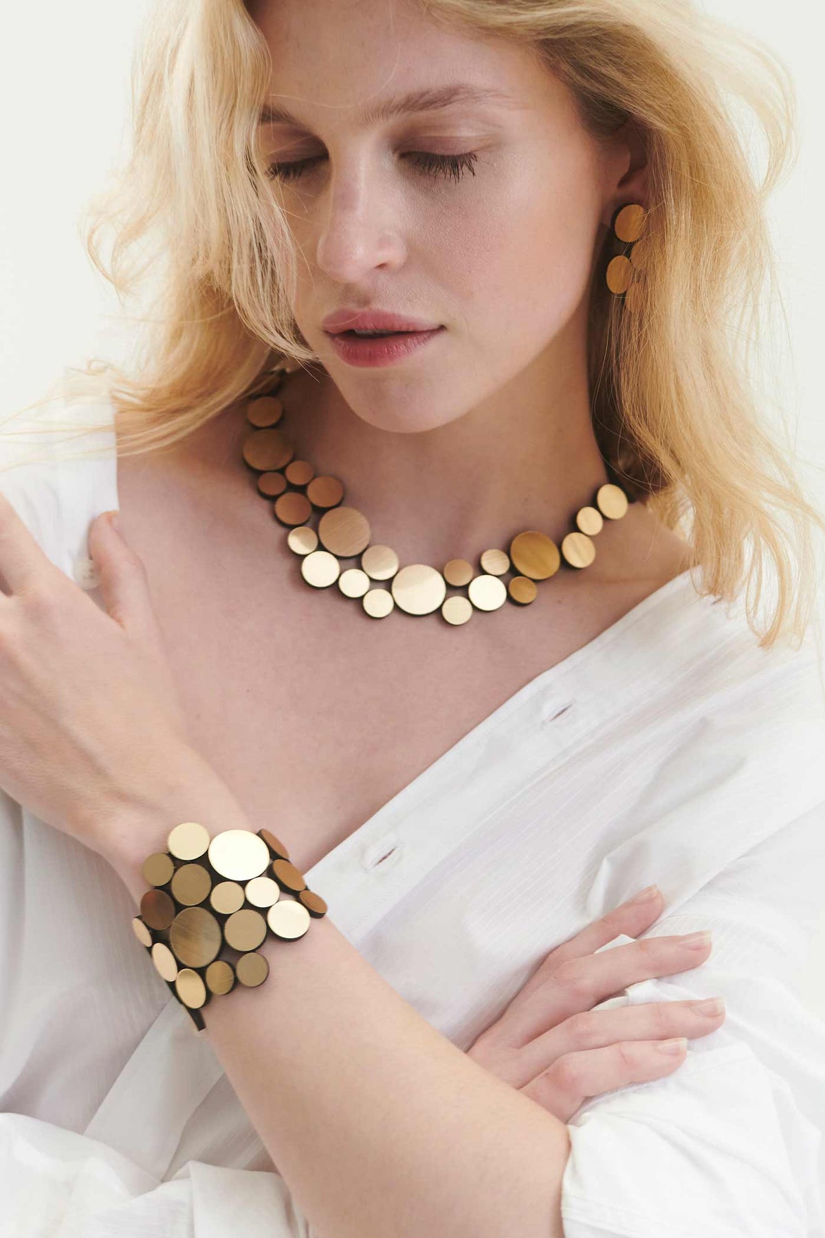 Iskin Sisters small gold necklace in metallic acrylic and suede, contemporary handmade jewelry