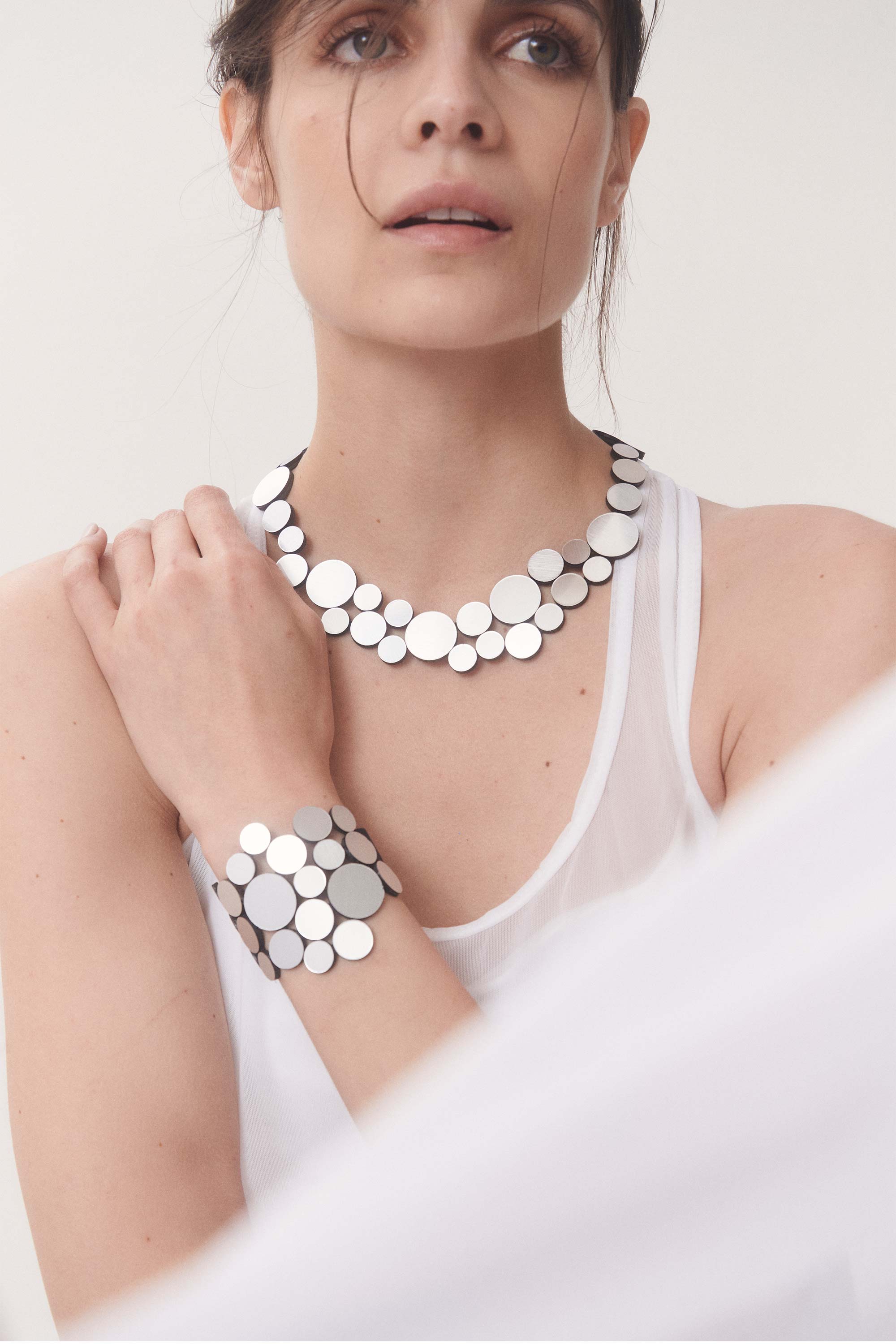Silver metallic acrylic small bib necklace from the Abstraction collection by Iskin Sisters