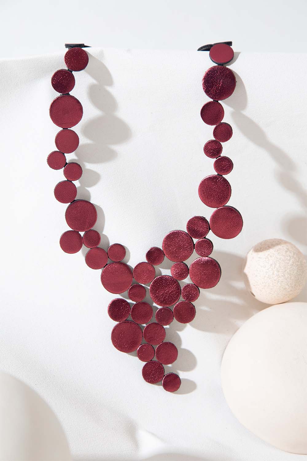 Abstraction V necklace in burgundy Argentine leather, handmade by Iskin Sisters