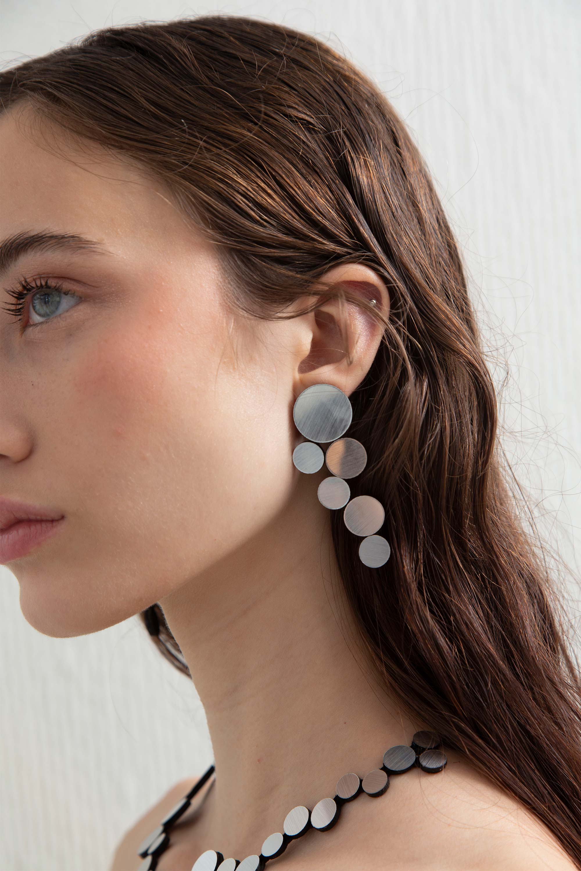 Abstraction Earrings Large by Iskin Sisters in silver metallic acrylic and soft suede, handcrafted by Iskin Sisters