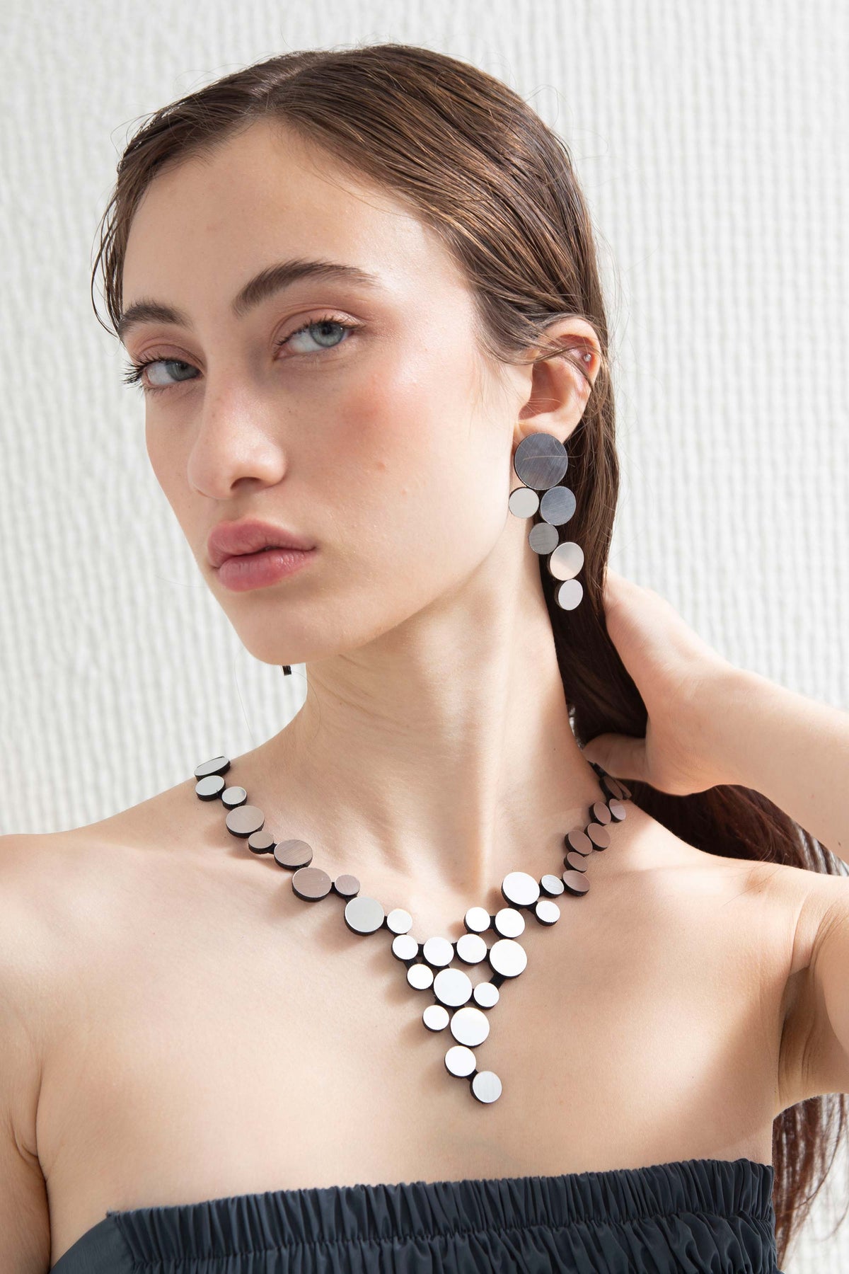 Large silver acrylic statement earrings from the Abstraction collection by Iskin Sisters, Argentina