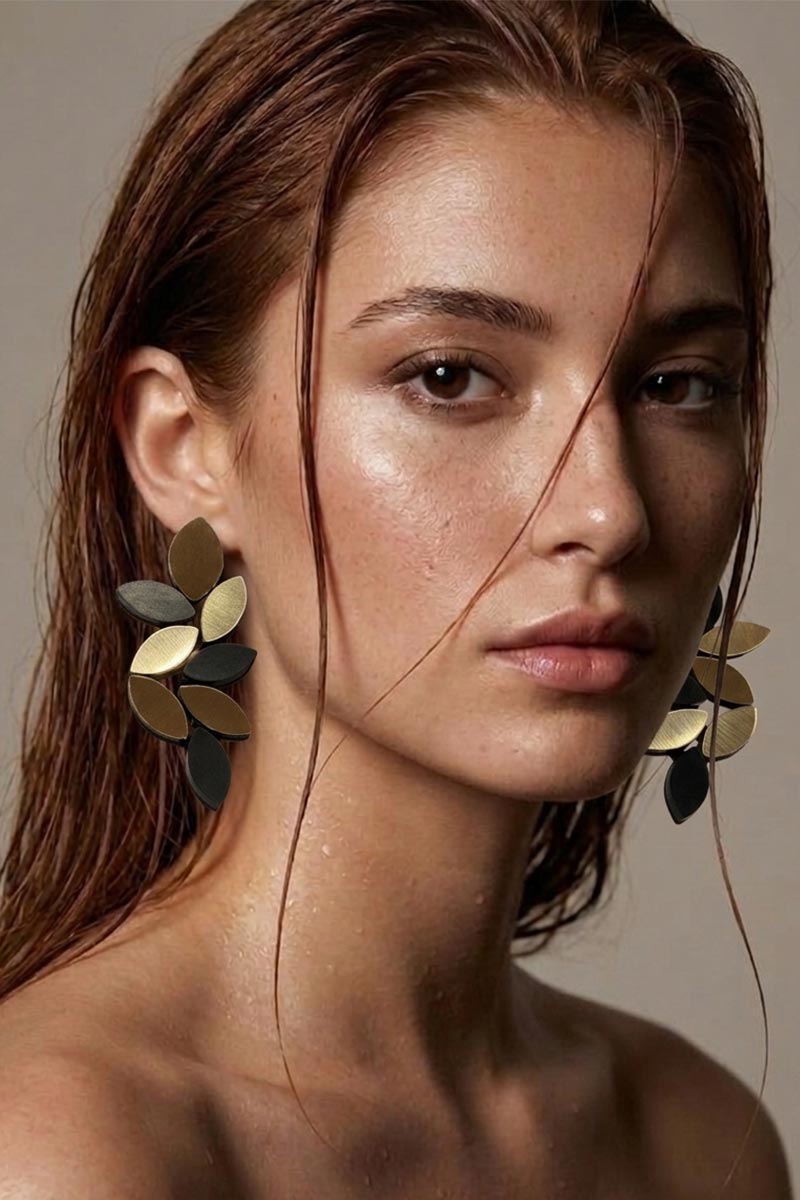Large leaf clip-on earrings in black and gold acrylic, lightweight with no piercing needed