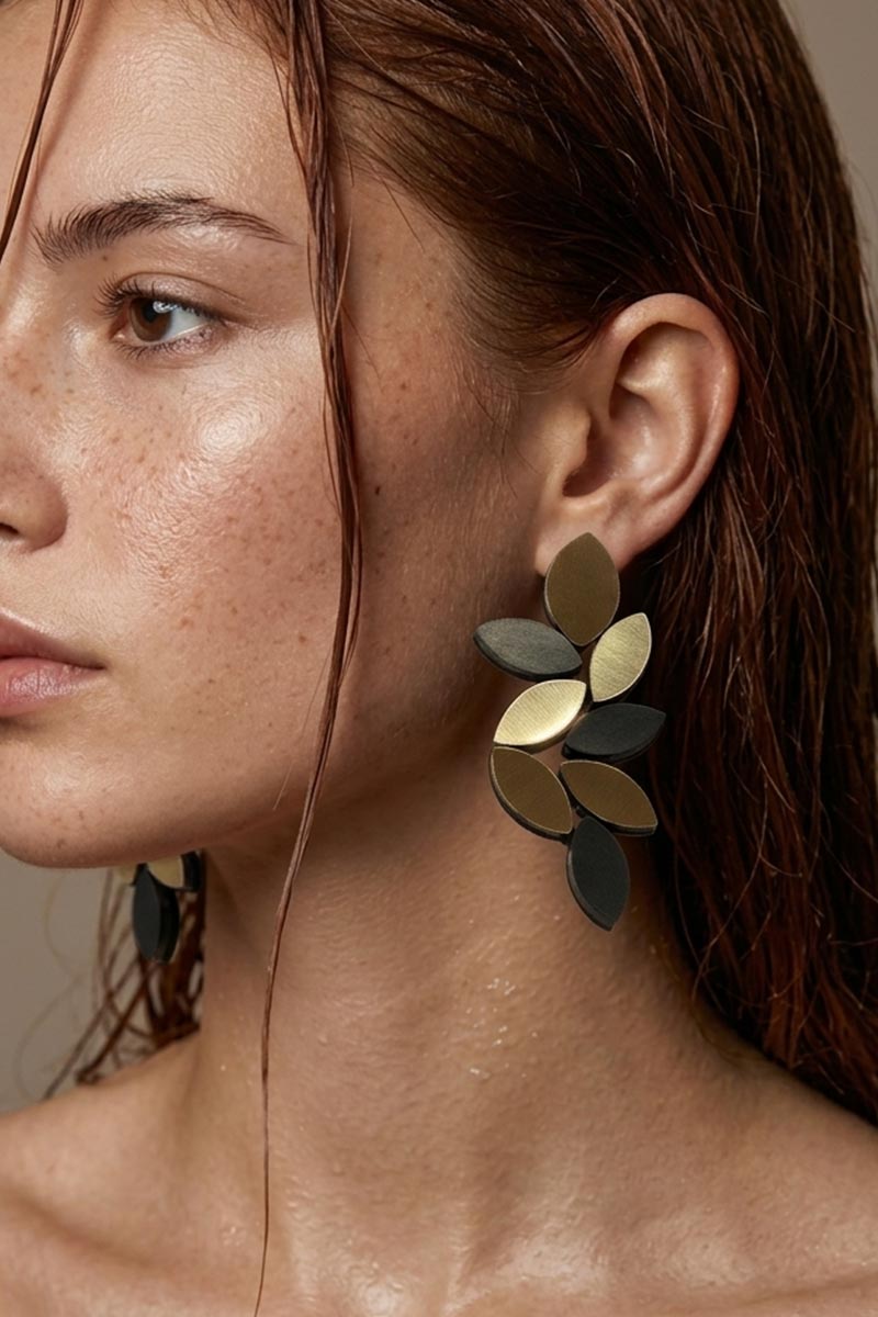 Large black and gold leaf clip-on earrings, handmade in our Buenos Aires atelier
