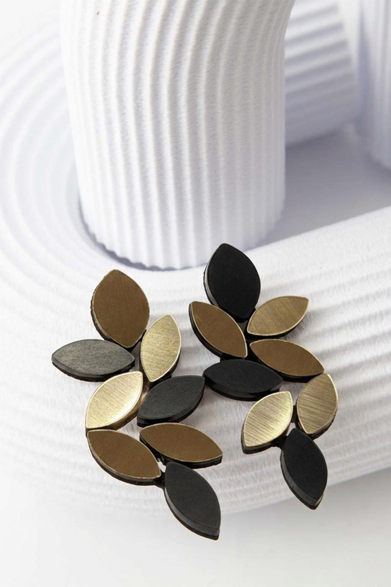 Black and gold leaf-shaped clip-on earrings from the Kate collection by Iskin Sisters