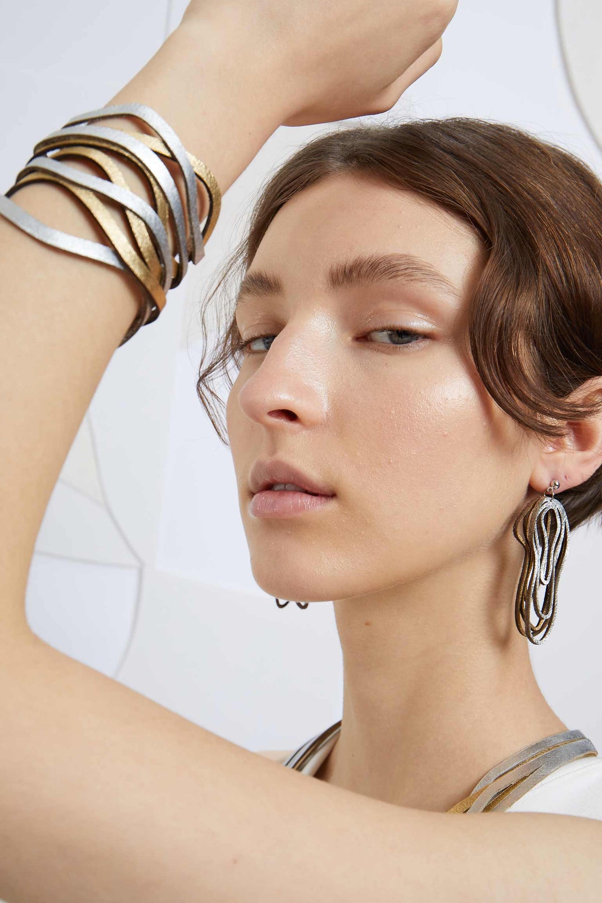 Iskin Sisters Curves Duo collection cuff bracelet in silver and gold leather, handmade jewelry