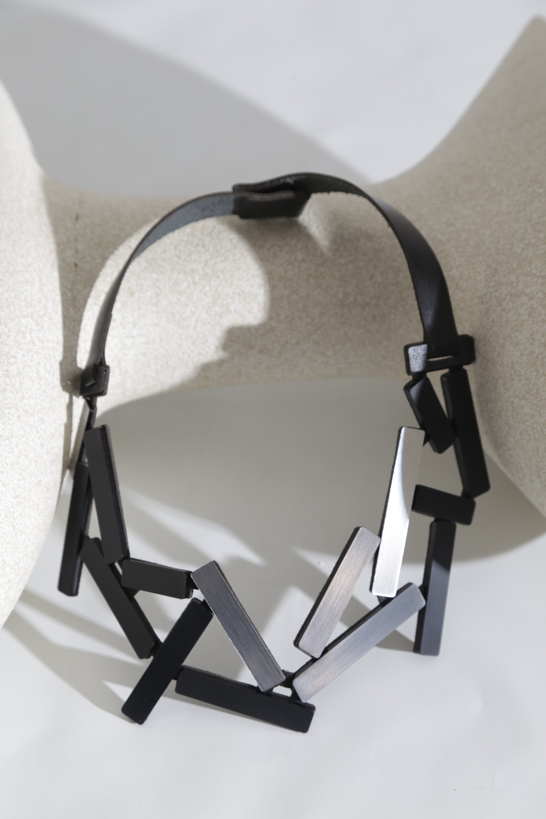 Contemporary large necklace in metallic acrylic and leather, Ray collection by Iskin Sisters