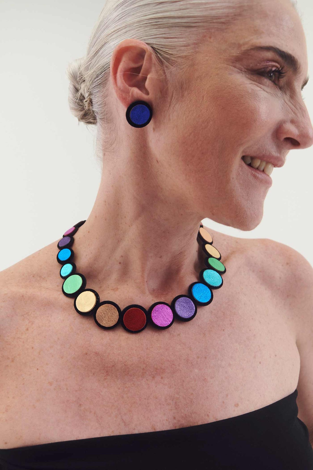 Contemporary rainbow-colored leather bib necklace designed and handmade by Iskin Sisters, Argentina