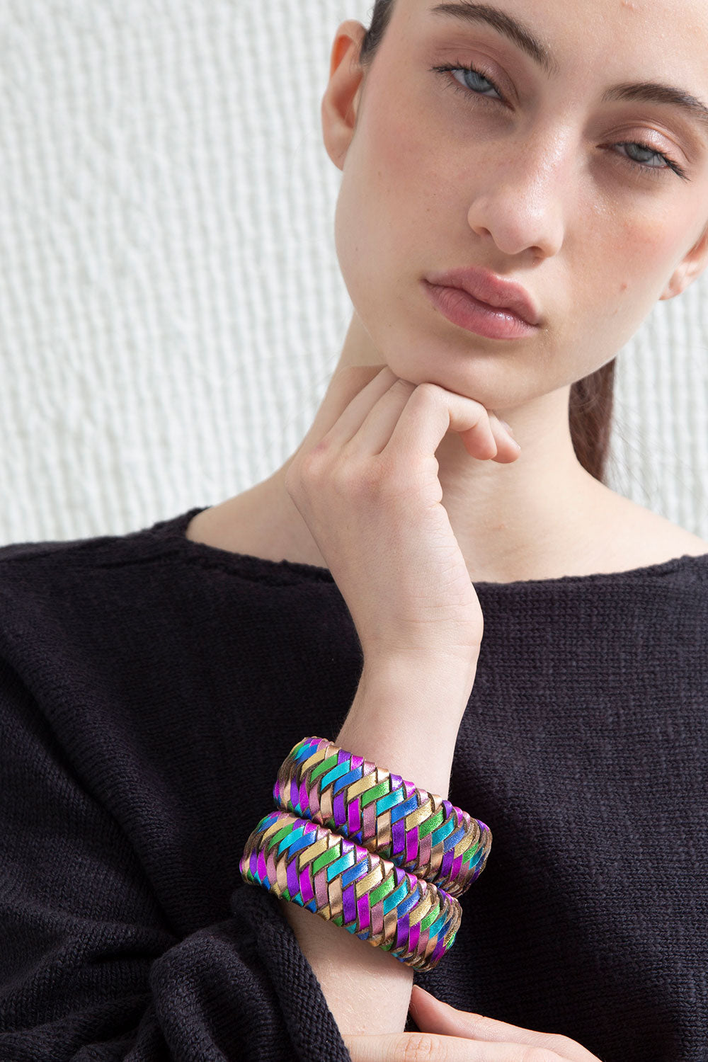Contemporary woven leather bracelet in rainbow colors, handmade by Iskin Sisters in Argentina