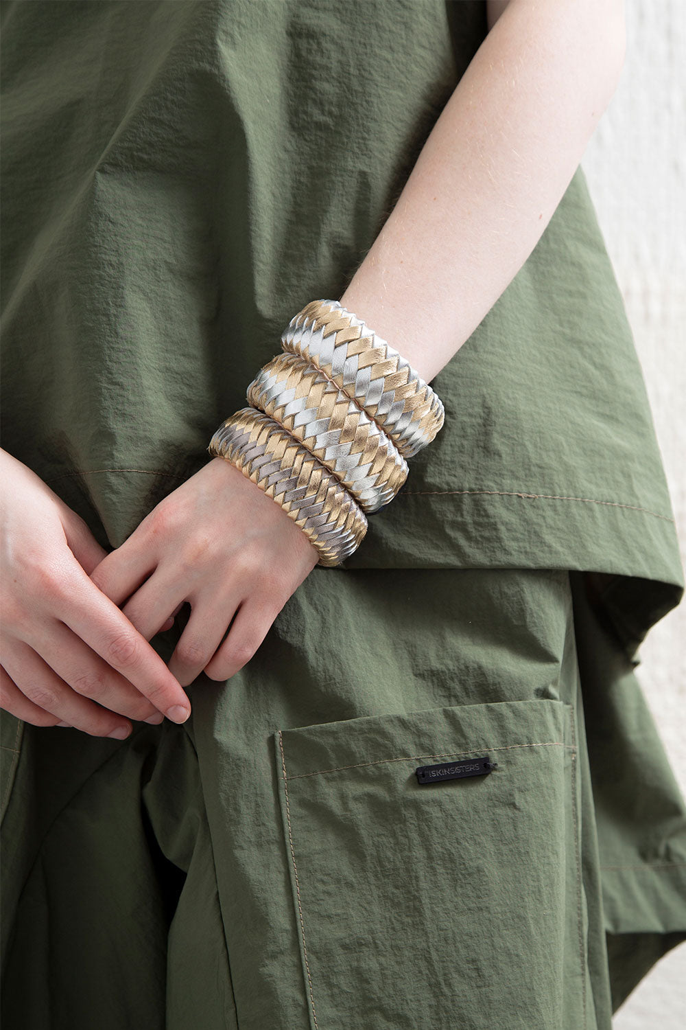 Silver and gold hand-woven leather bracelet from the Rainbow collection by Iskin Sisters, Argentina