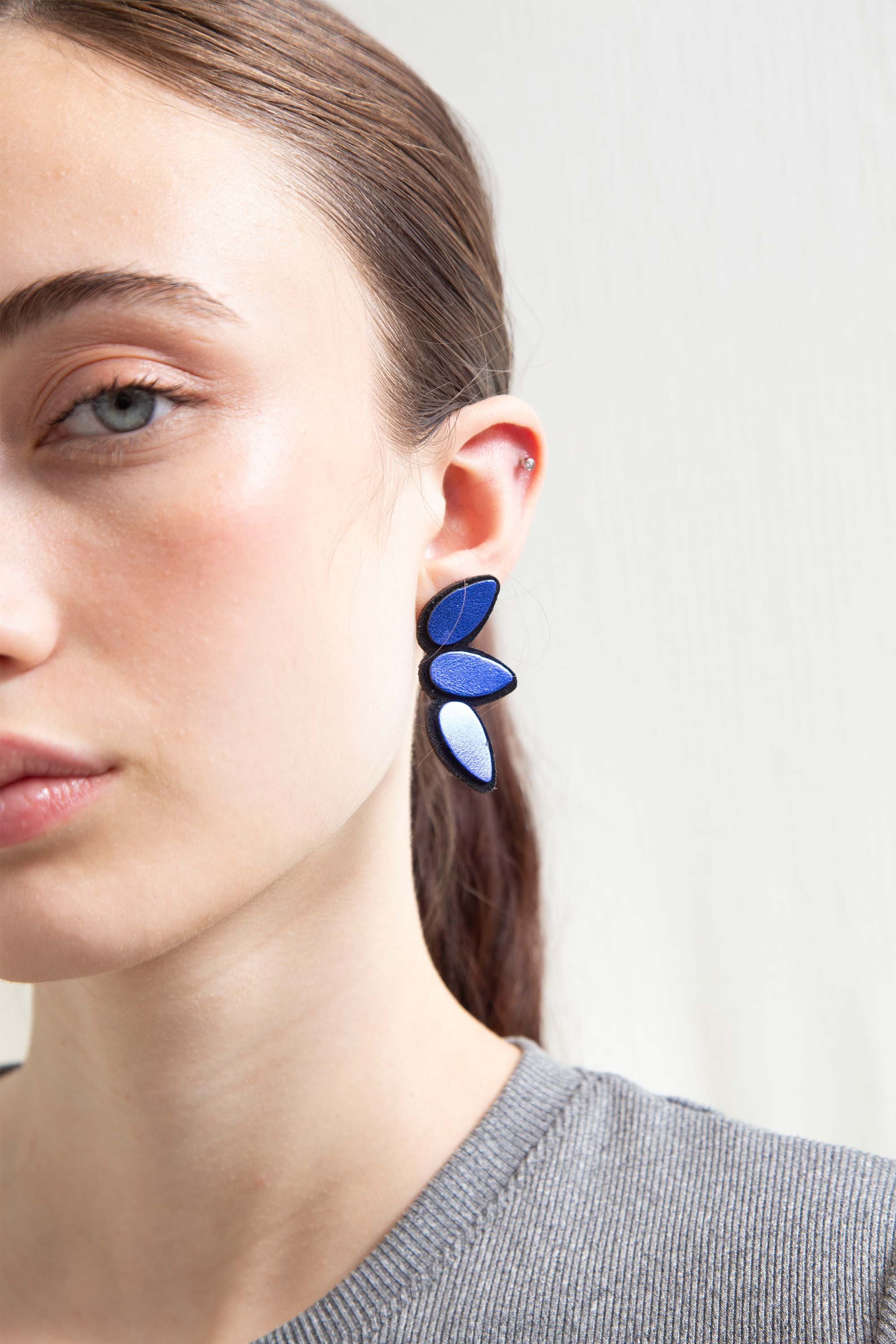Iskin Sisters Raindrop collection small earrings in blue leather, handmade in Buenos Aires