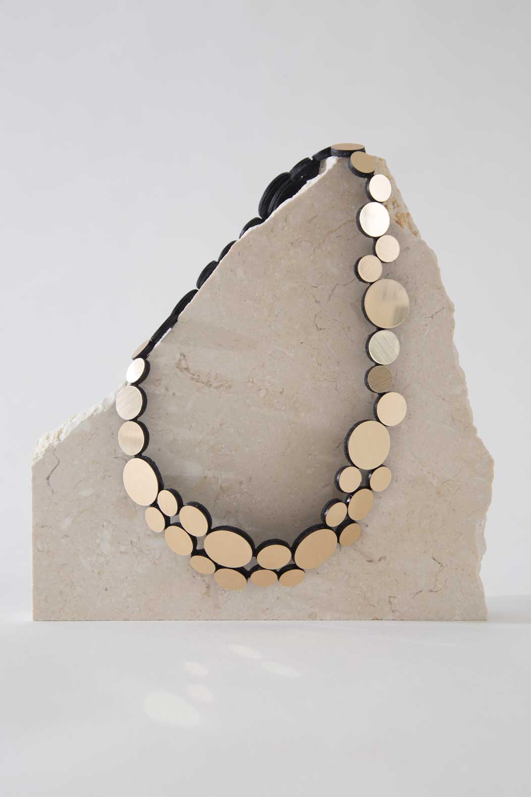 Abstraction Necklace Small by Iskin Sisters in gold metallic acrylic and soft suede, Argentina