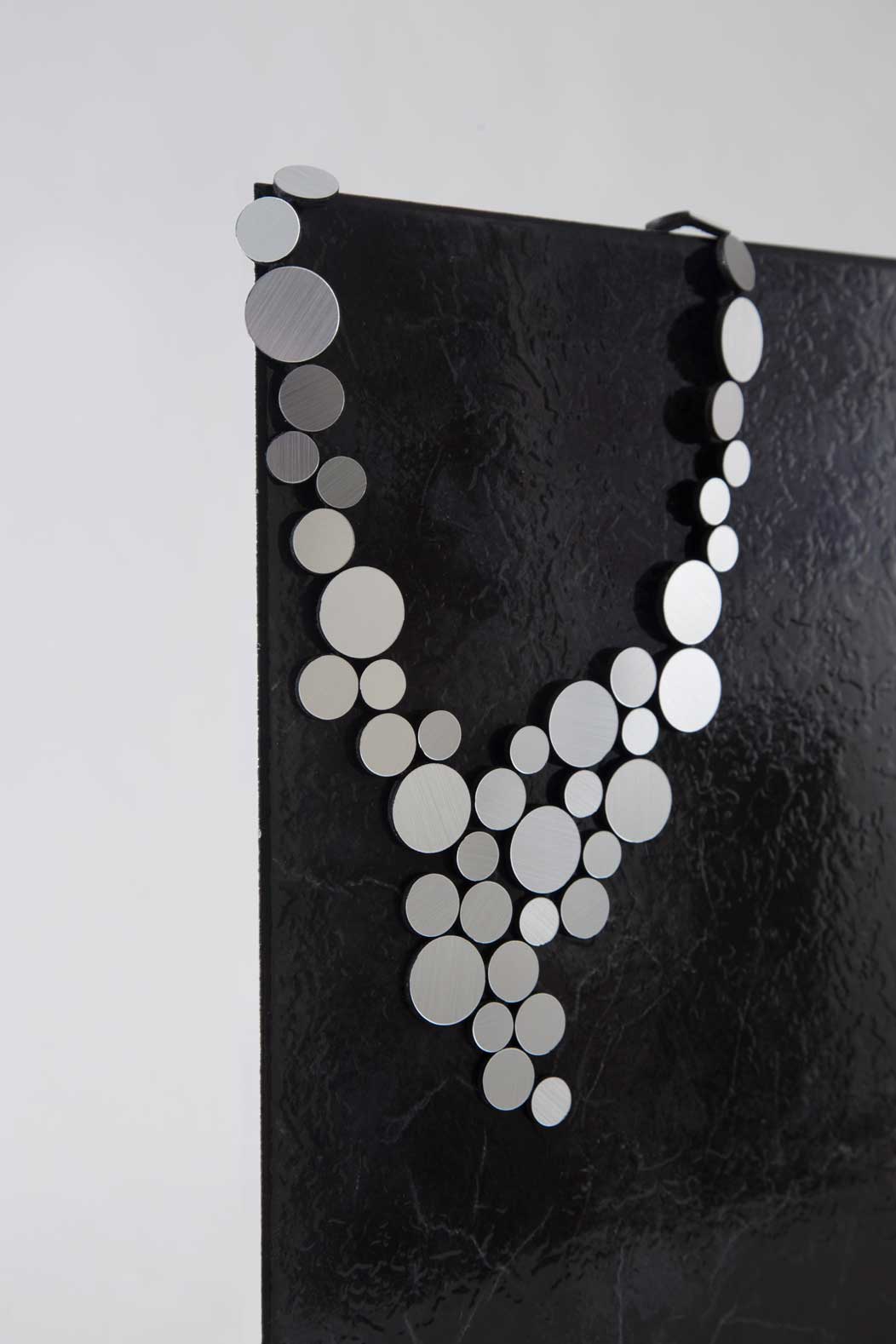 Silver V-shaped bib necklace with magnetic clasp, contemporary jewelry handmade in Buenos Aires