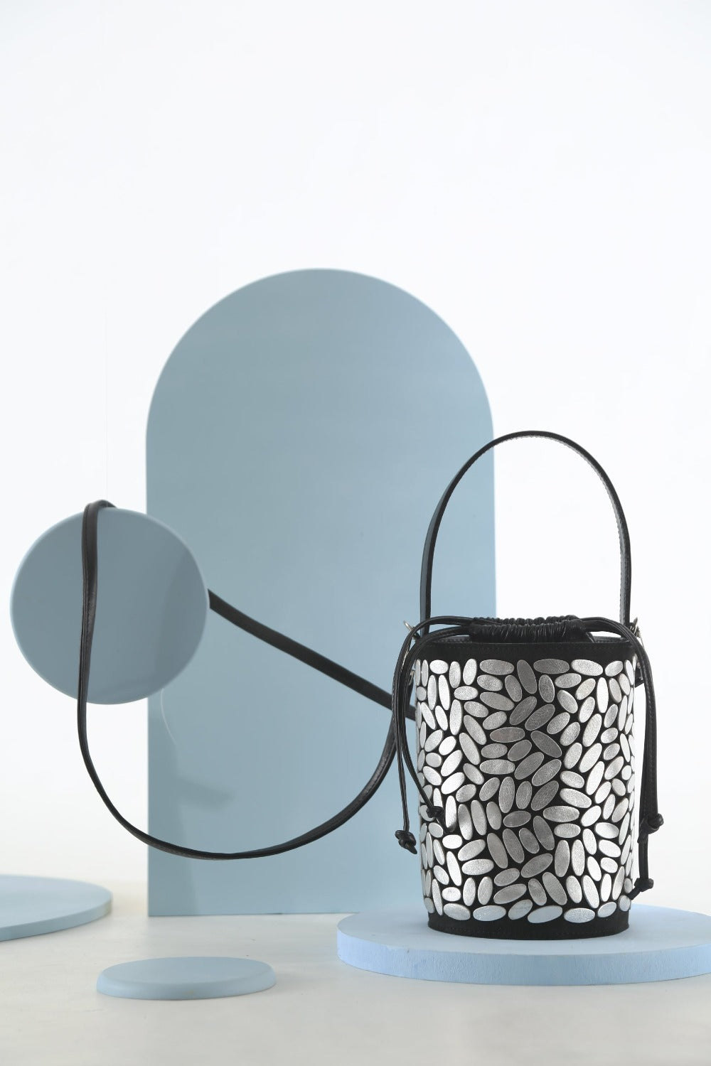 Handcrafted silver hand-cut leather bucket bag, Emma collection design by Iskin Sisters, Argentina