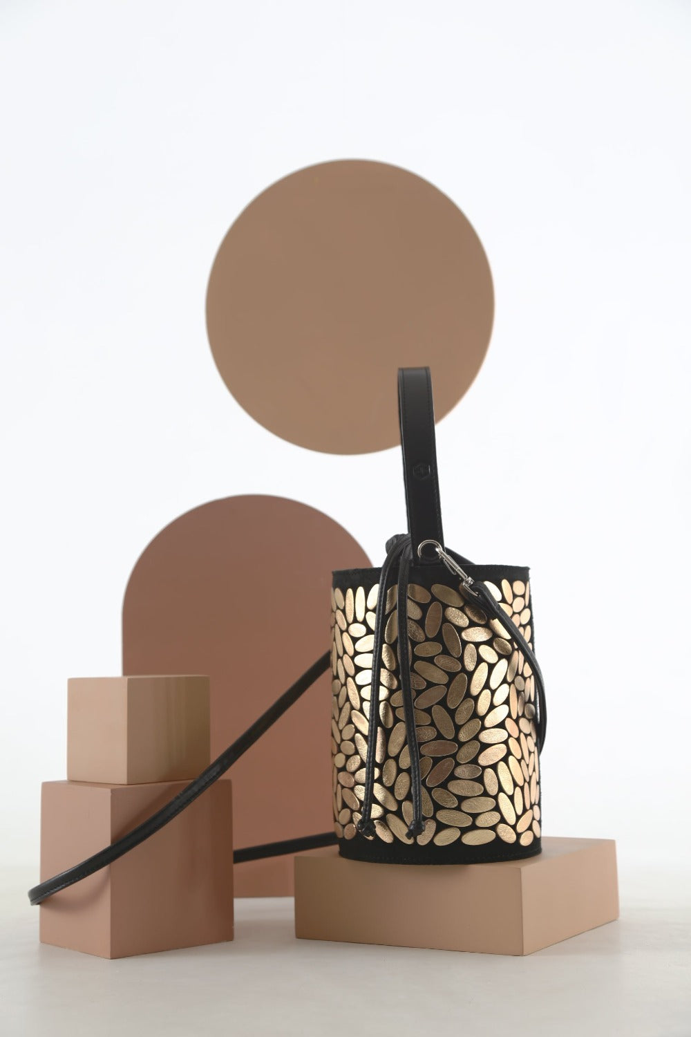 Gold hand-cut leather bucket bag from the Emma collection by Iskin Sisters, made to order, handcrafted by Iskin Sisters
