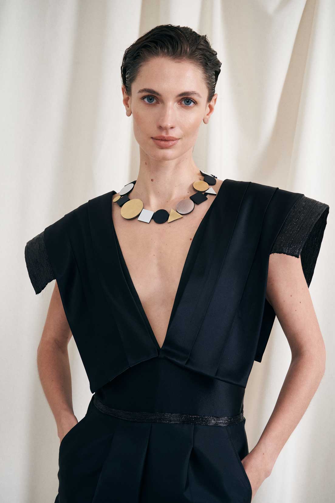 Contemporary geometric bib necklace in acrylic and hand-cut leather by Iskin Sisters, Argentina