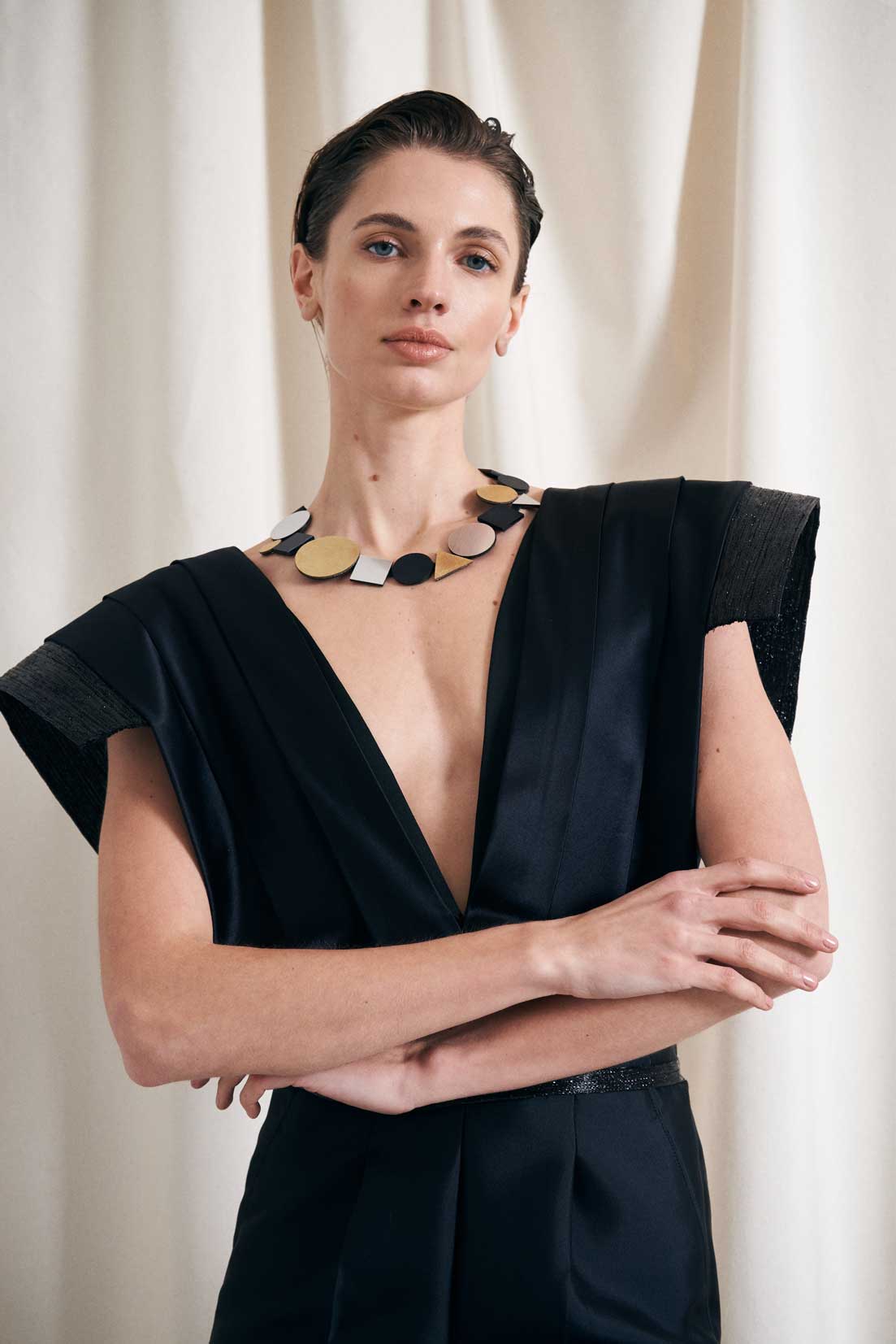 Slow-fashion Bauhaus geometric bib necklace in acrylic and leather by Iskin Sisters, Argentina