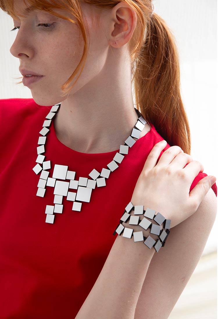 Silver acrylic square V necklace from the Bauhaus collection by Iskin Sisters, Buenos Aires
