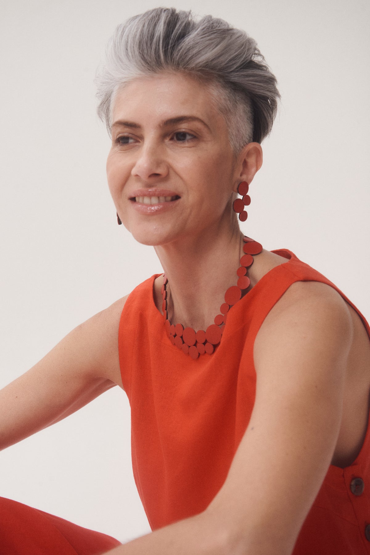 Small red leather statement necklace, handmade in our Buenos Aires atelier