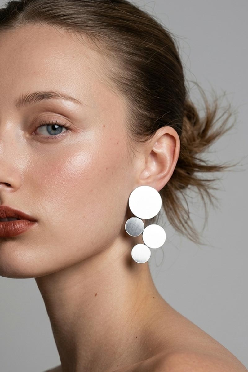 Delicate round silver clip-on earrings, handmade in our Buenos Aires atelier