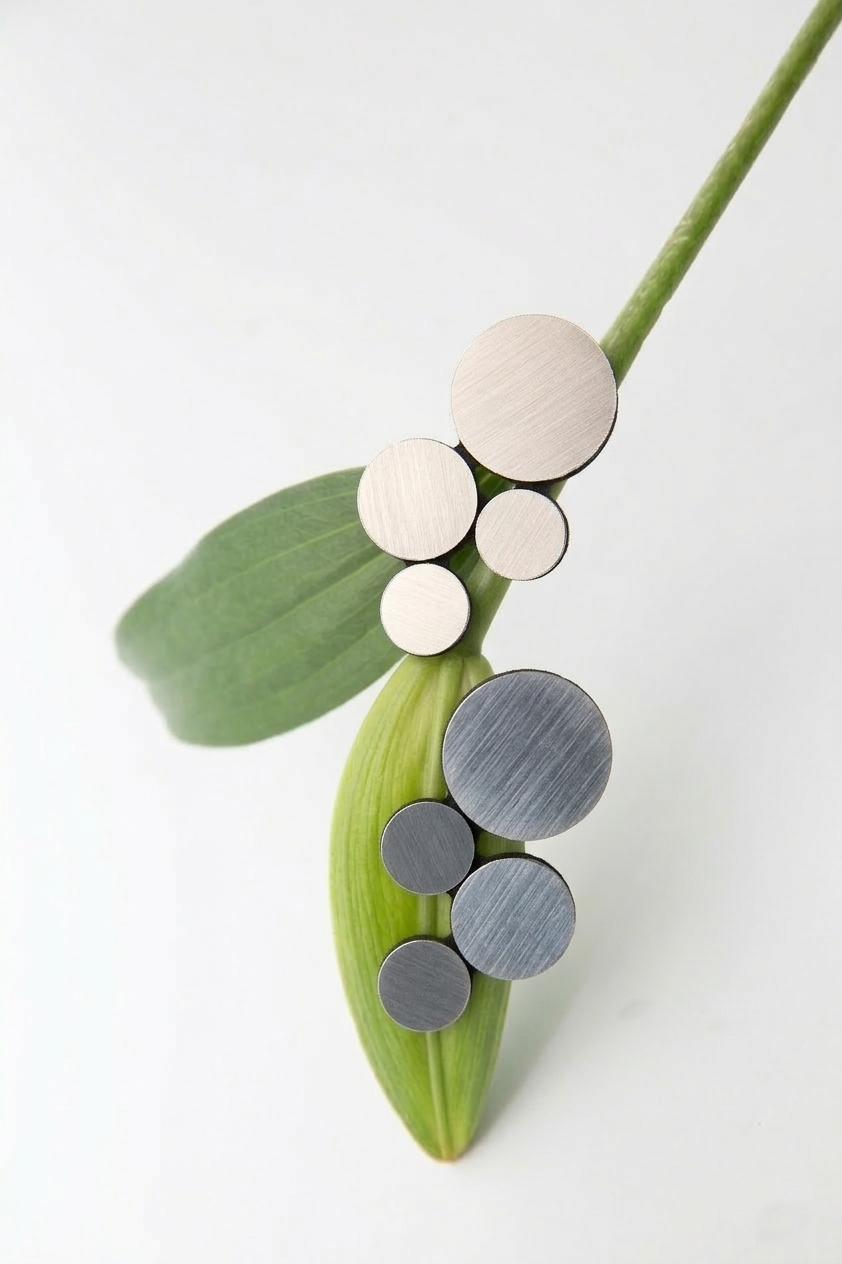 Small silver Abstraction clip-on earrings in mirrored acrylic, contemporary jewelry by Iskin Sisters