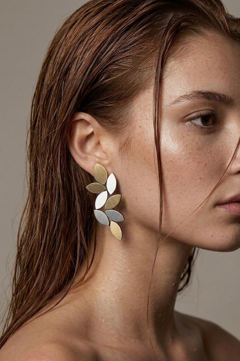 Large silver and gold leaf clip-on earrings, handmade in our Buenos Aires atelier