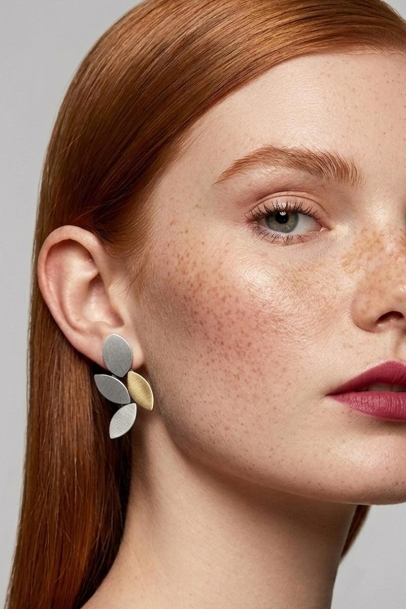 Leaf-shaped clip-on earrings in silver and gold, handmade in our Buenos Aires atelier
