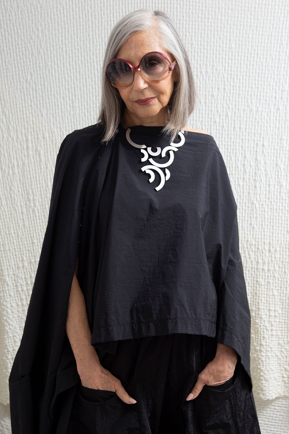 Silver mirrored acrylic orbit necklace from the Mies collection, Iskin Sisters