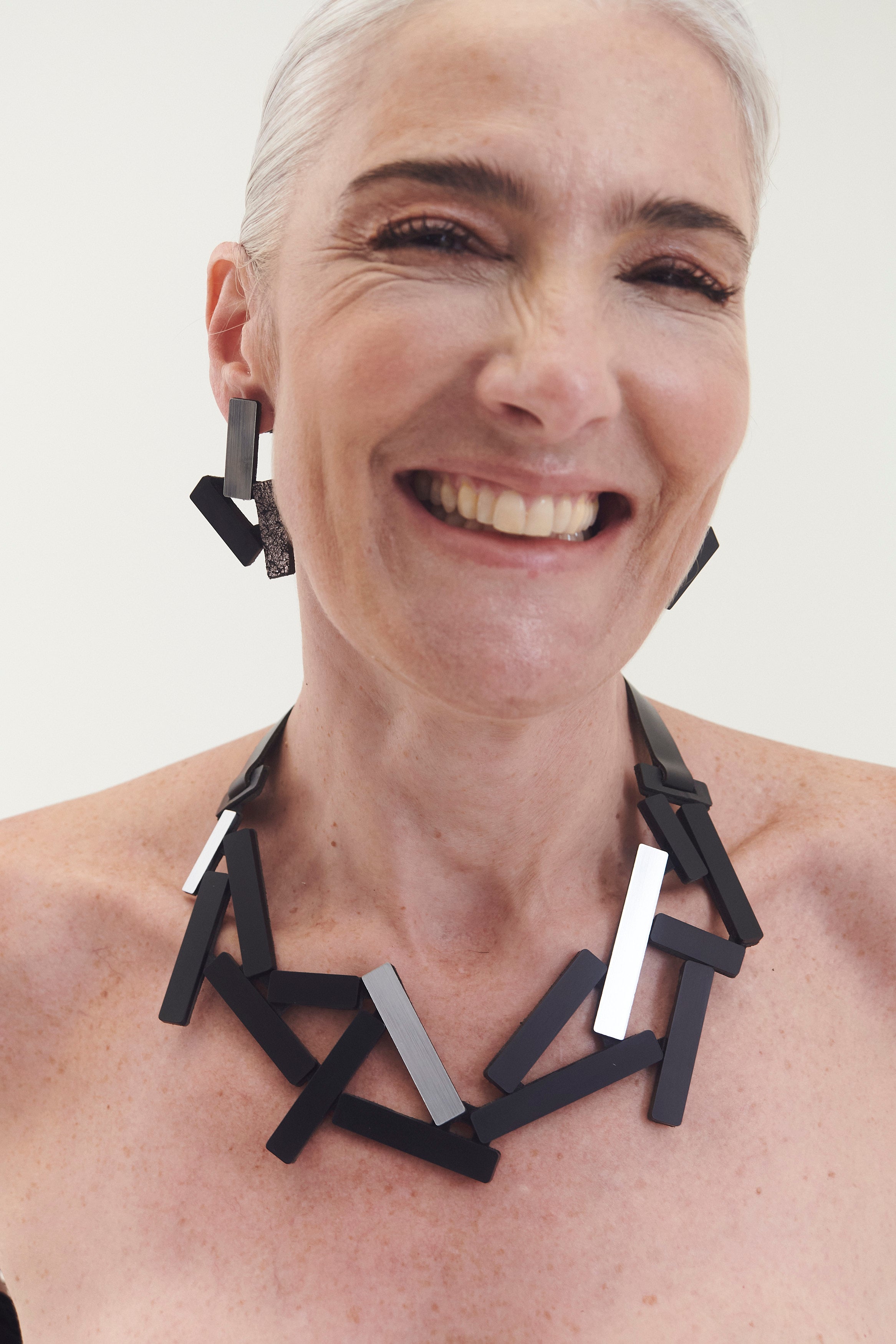 Large silver and black acrylic statement necklace from the Ray collection by Iskin Sisters