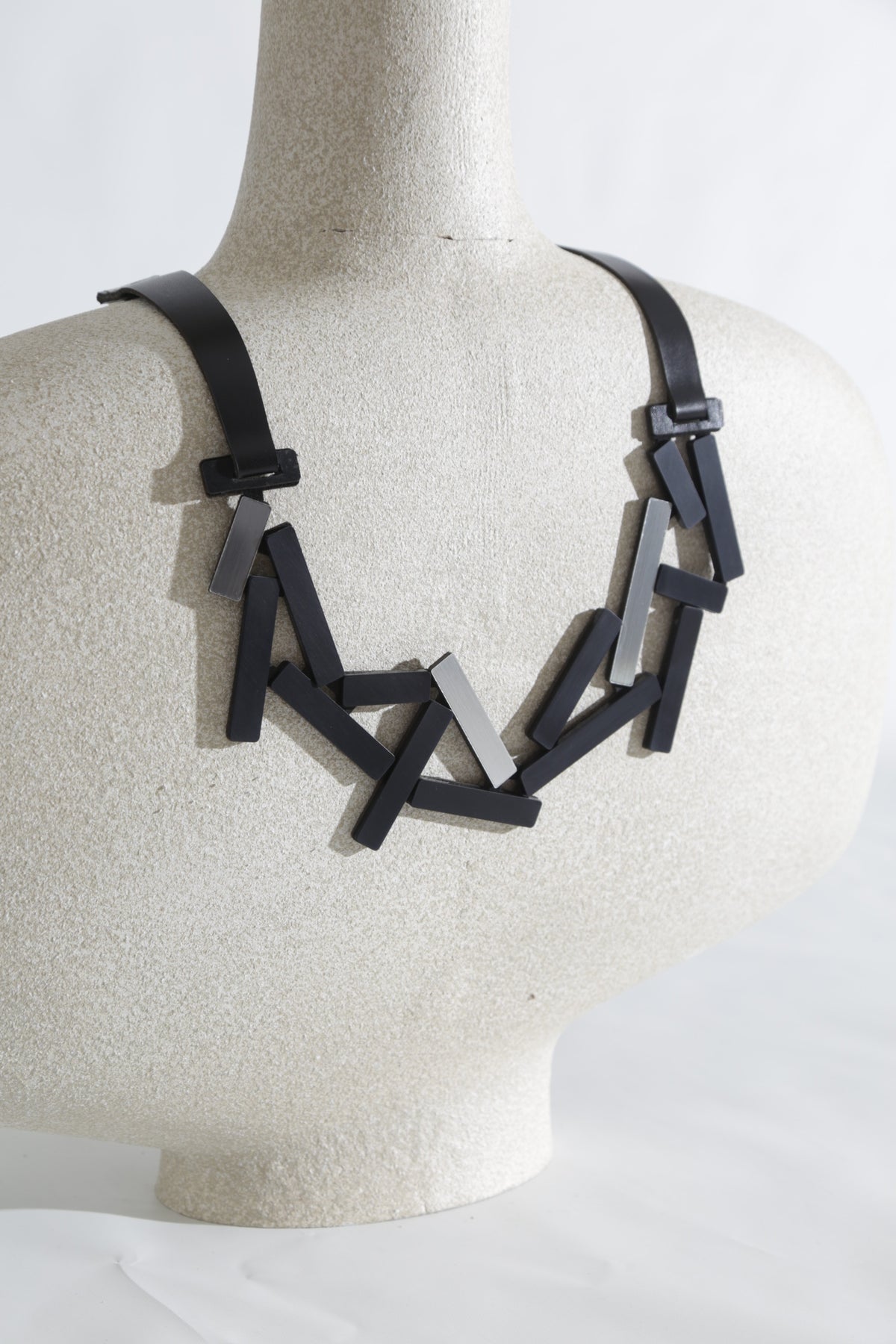 Iskin Sisters Ray collection large necklace in silver and black acrylic, handmade contemporary jewelry