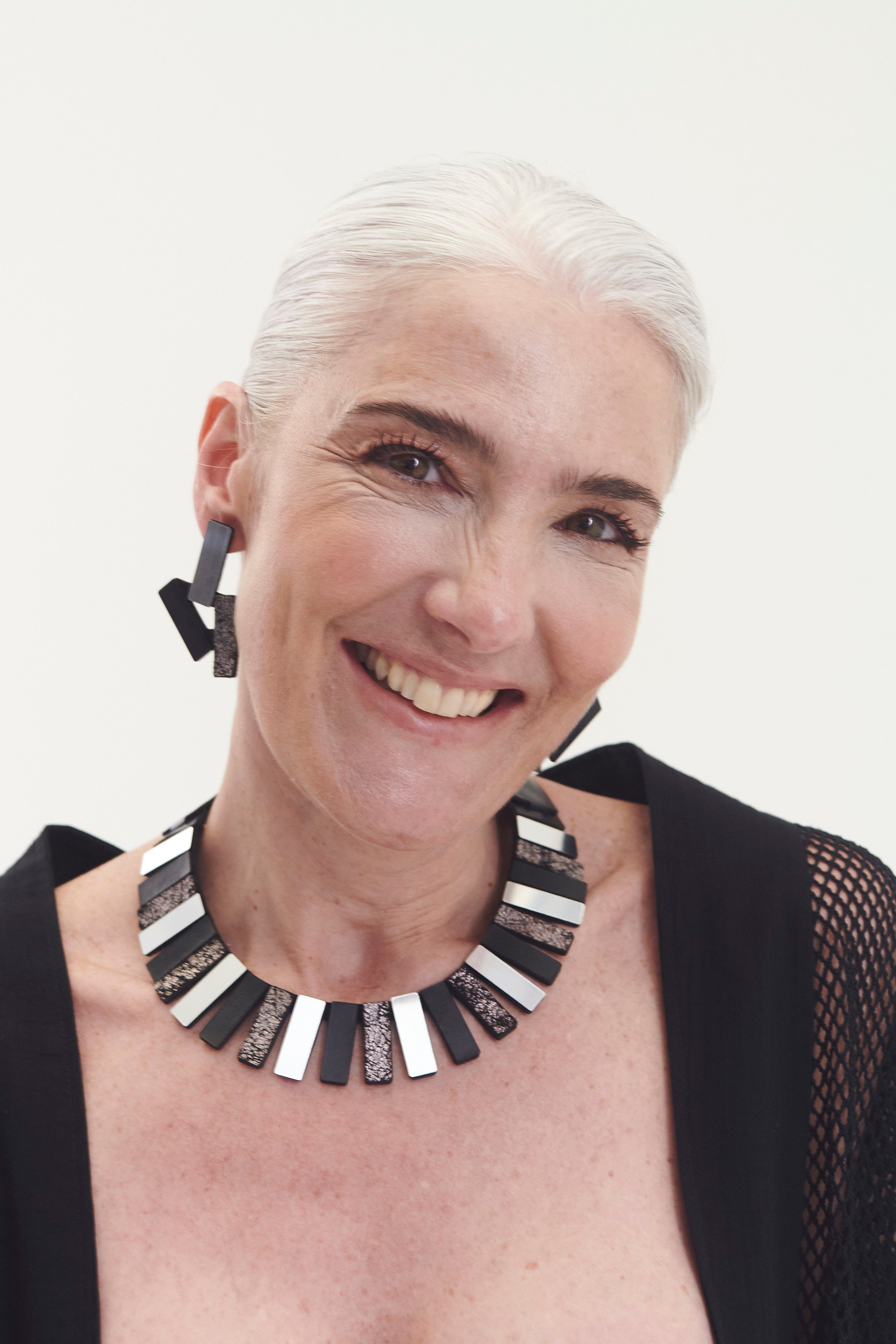 Ray Egyptian collar necklace in silver, black and pewter by Iskin Sisters