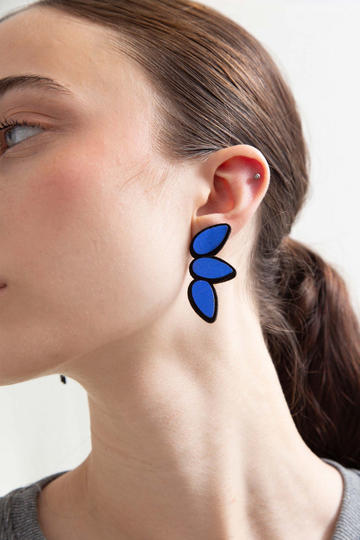 Blue leather drop-shaped small earrings from the Raindrop collection by Iskin Sisters, Argentina