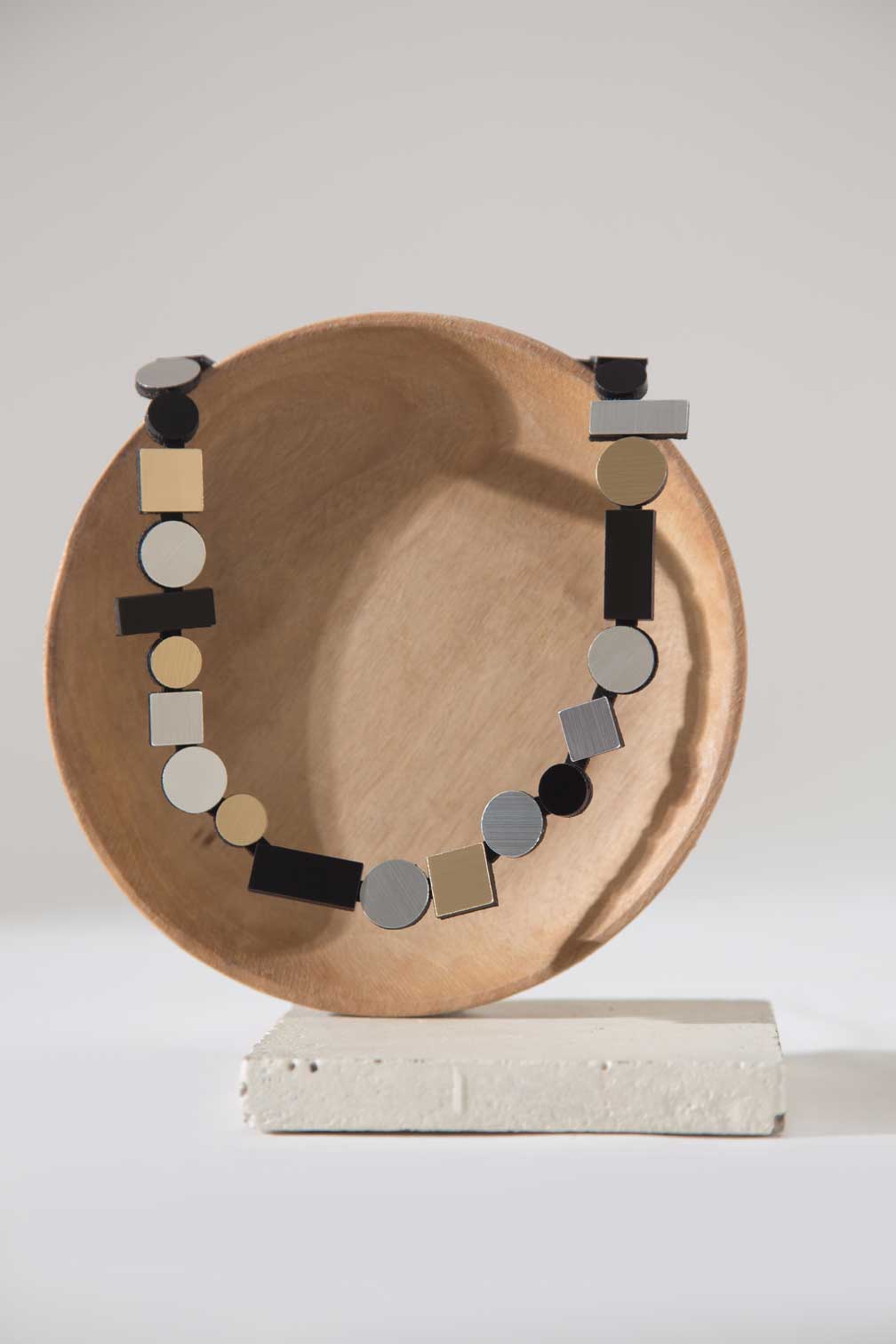 Iskin Sisters Bauhaus collection round bib necklace in metallic acrylic, handmade contemporary jewelry