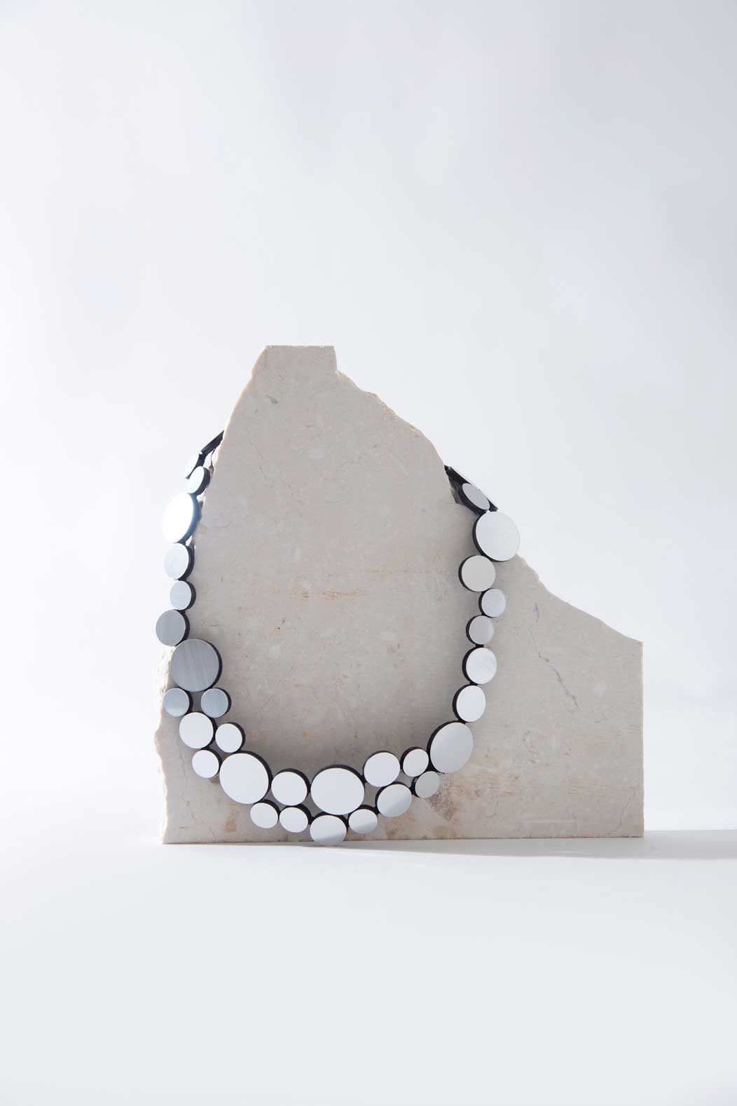 Abstraction Necklace Small by Iskin Sisters in silver metallic acrylic and soft suede, handcrafted by Iskin Sisters