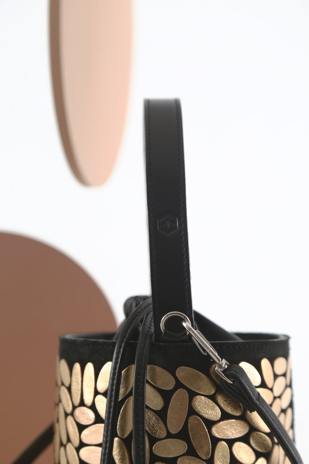 Contemporary gold leather bucket bag handmade by Iskin Sisters in their Buenos Aires atelier