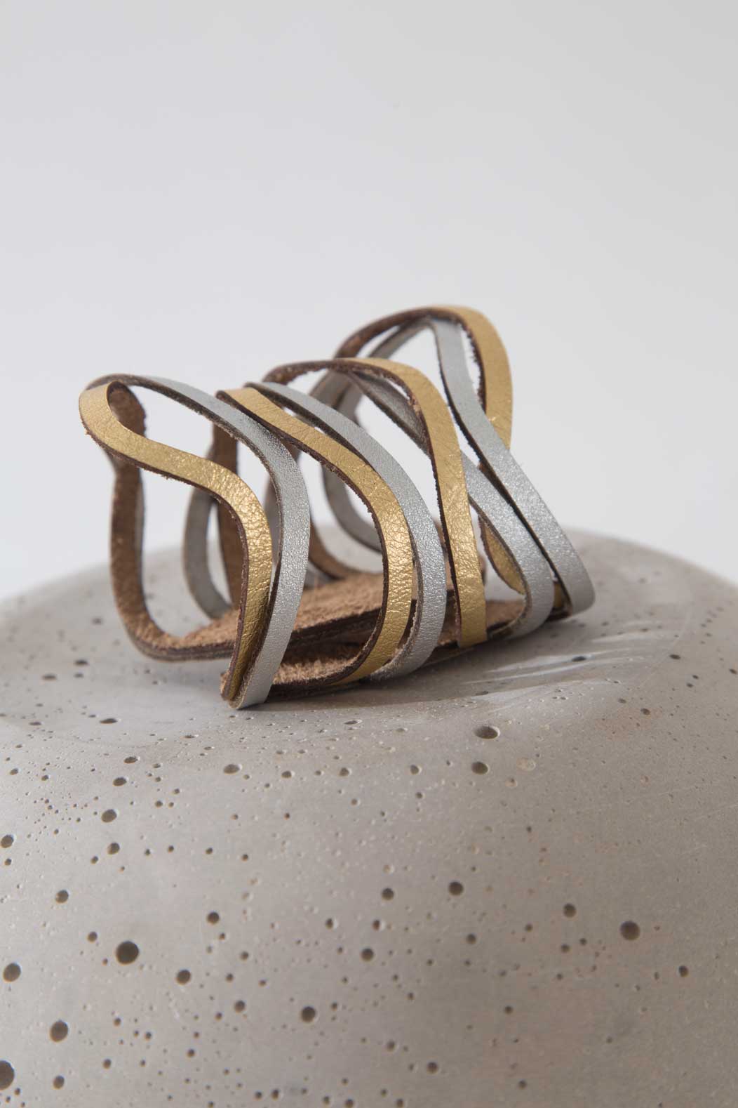 Contemporary leather cuff bracelet in silver and gold, Curves Duo collection by Iskin Sisters