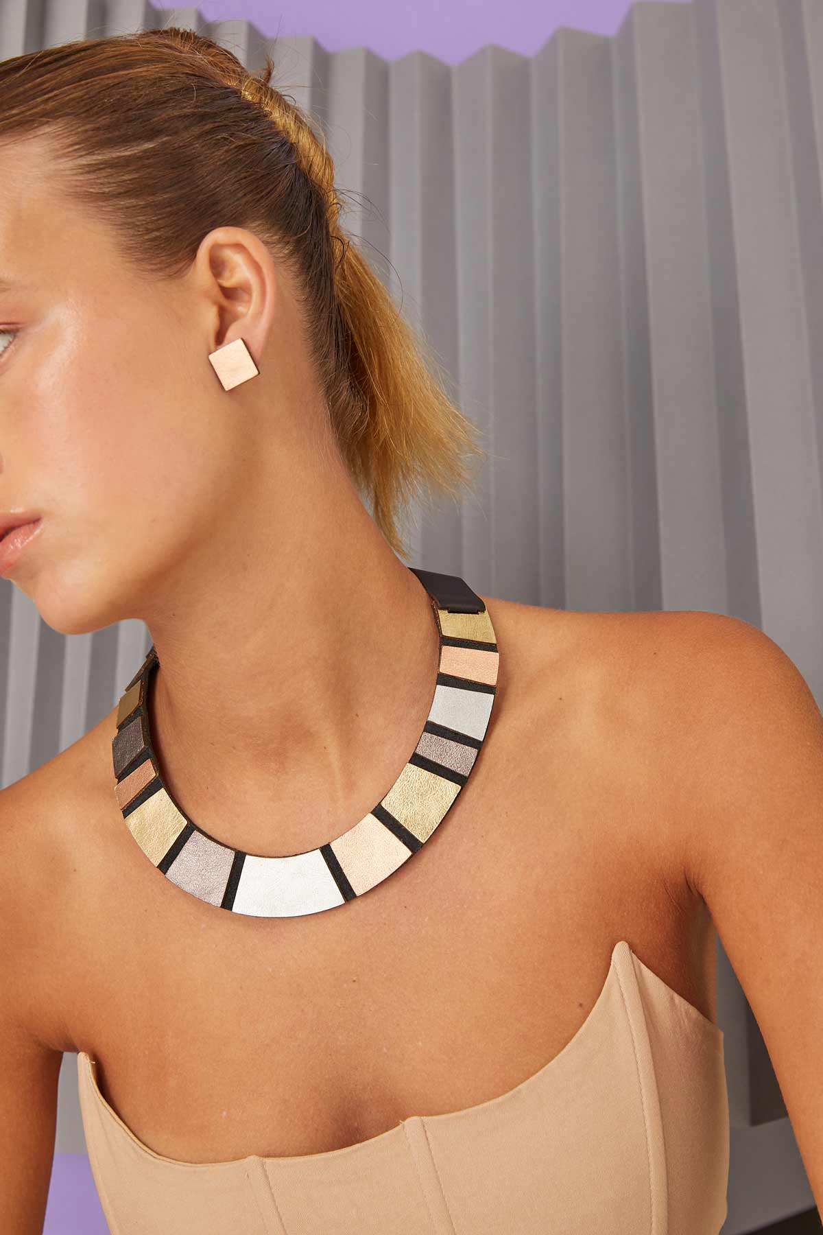 Slow-fashion metallic leather bib necklace from the Rainbow collection by Iskin Sisters, Argentina